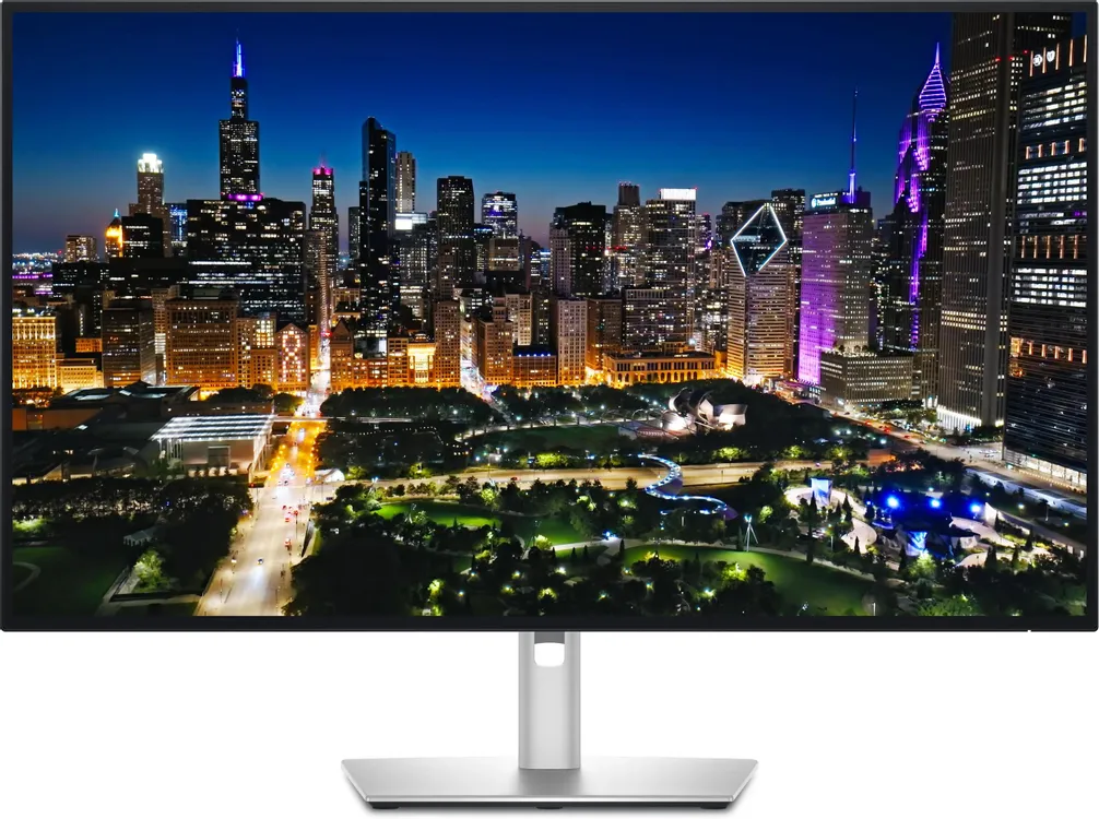 Dell UltraSharp U3225QE вид спереди на подставке с поворотным механизмом, экран с изображением ночного города